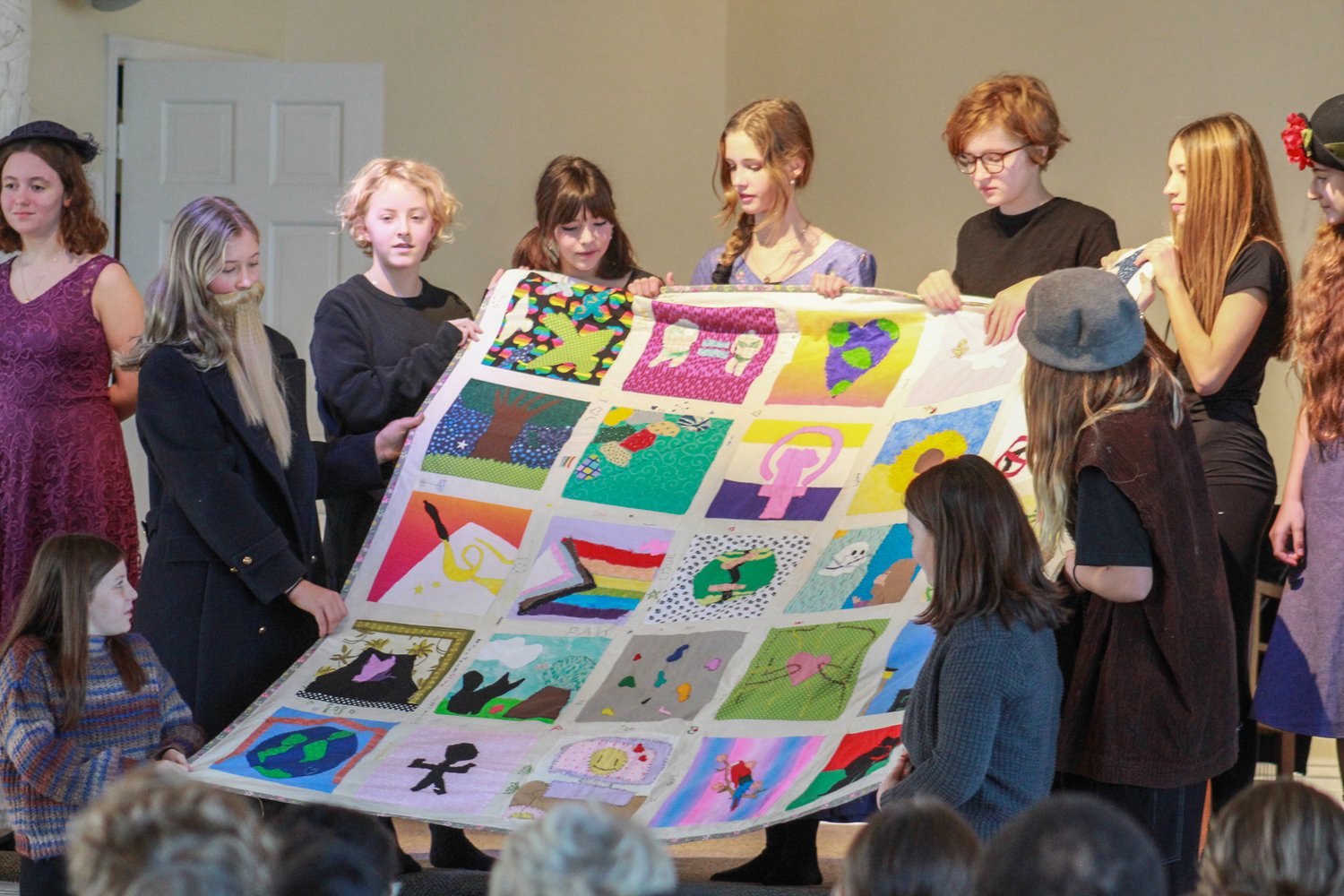 OHMS girls displaying their quilt project