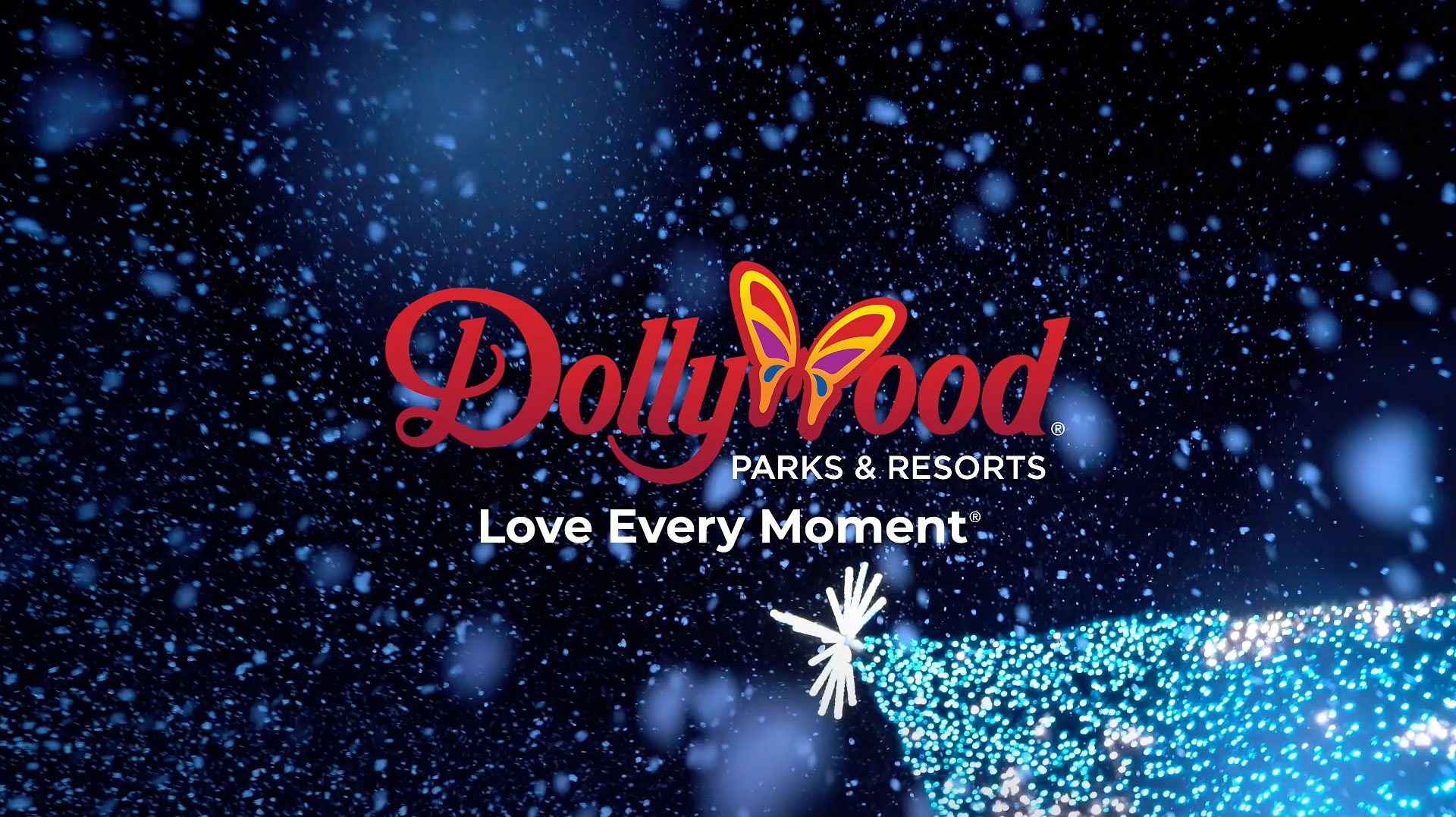Dollywood logo and tagline over snowy night sky